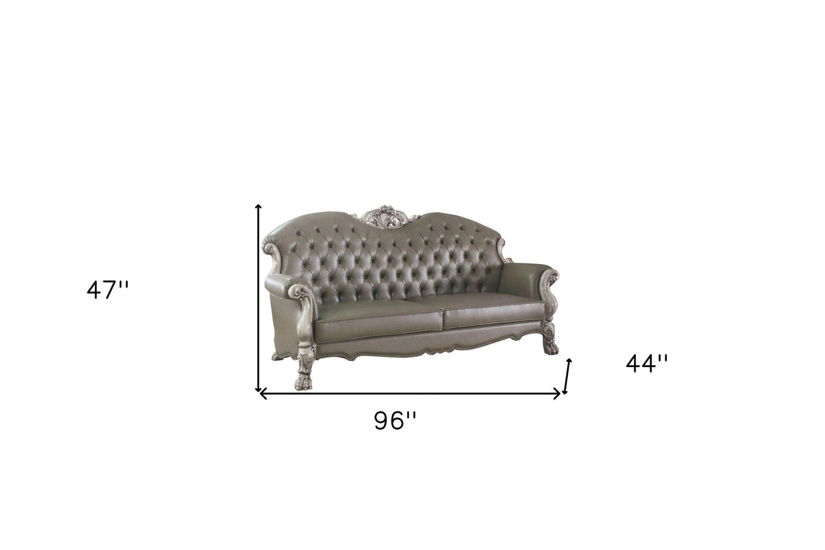 The Oryndal – 96" Bone Faux Leather Sofa with Toss Pillows & White Legs